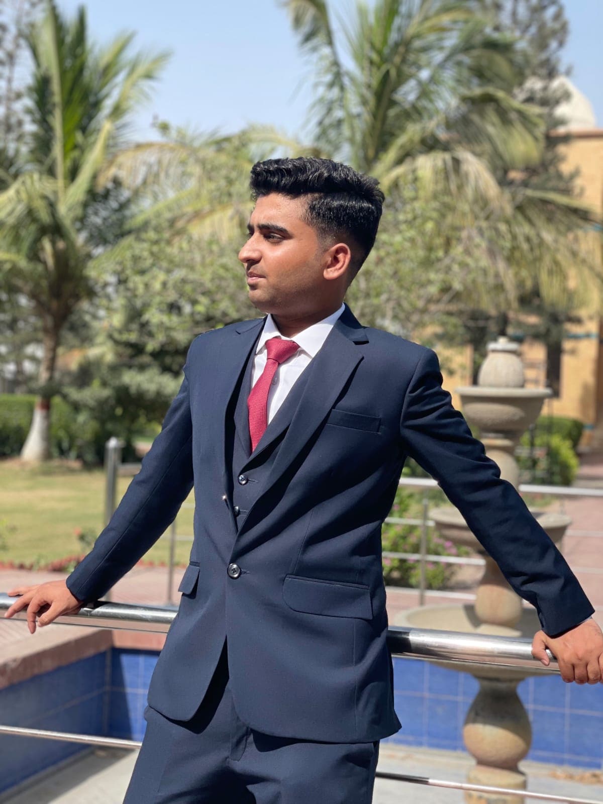 Muneeb Ur Rehman leaning on a railing